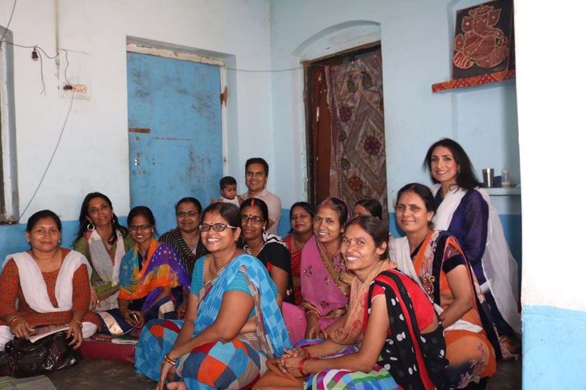 a group of women posing