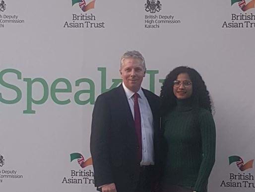 British Asian Trust CEO Richard Hawkes and Ambassador Hajra Khan being photographed in front of media board